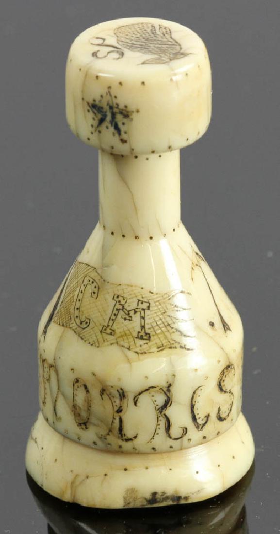 Whaling Related Scrimshawed Stamp: Rare 18th/19th century whale bone stamp carved with a whale on the bottom and scrimshawed with a whale, ship, star, harpoon, flag initialed 'CM' and Commodore Morris, 2" H. Provenance: West Palm Beach