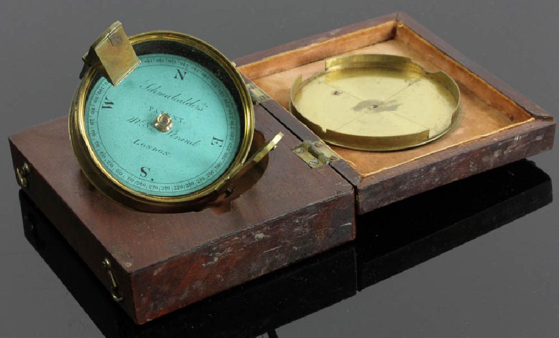 English Brass Schmalcalder Compass: Rare 19th century English brass compass labeled 'Schmalcalder's Patent West 82 The Strand London', original fitted mahogany box inlaid with bone cartouche scrimshawed in a ship design, 1 1/2" H x 4 1/