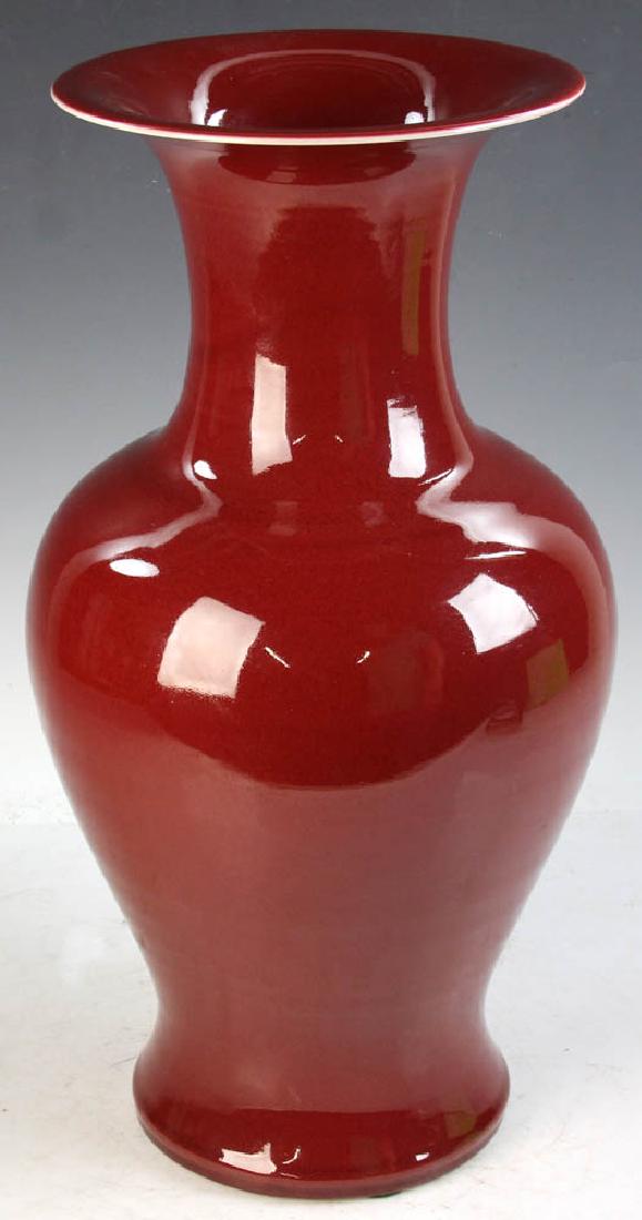Large Chinese Ox Blood Red Porcelain Vase: Large Chinese ox-blood red porcelain Zun vase, opening rim as phoenix-shaped, 18 3/4" H.