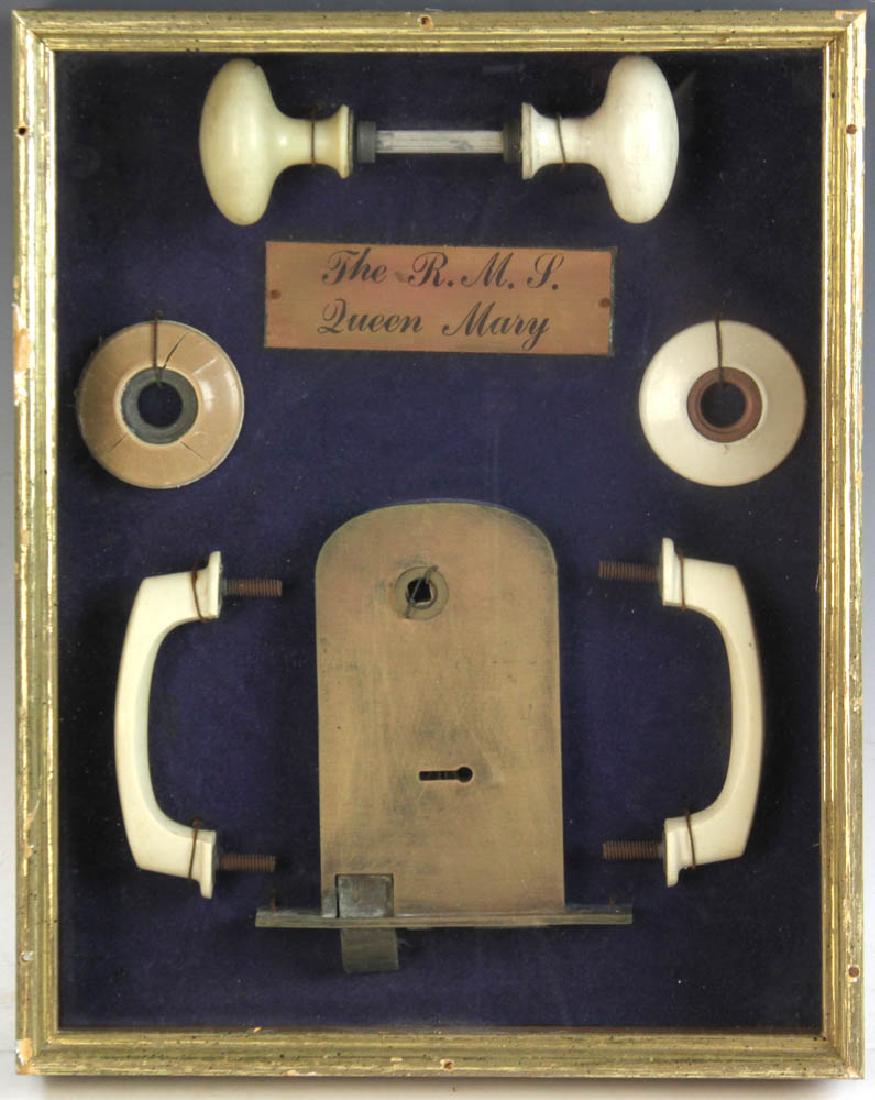 R.M.S Queen Mary Bone Door Knobs: R.M.S Queen Mary bone door knobs displayed in a shadow box, 14 1/2" x 11 1/2". Provenance: Balboa, California estate.