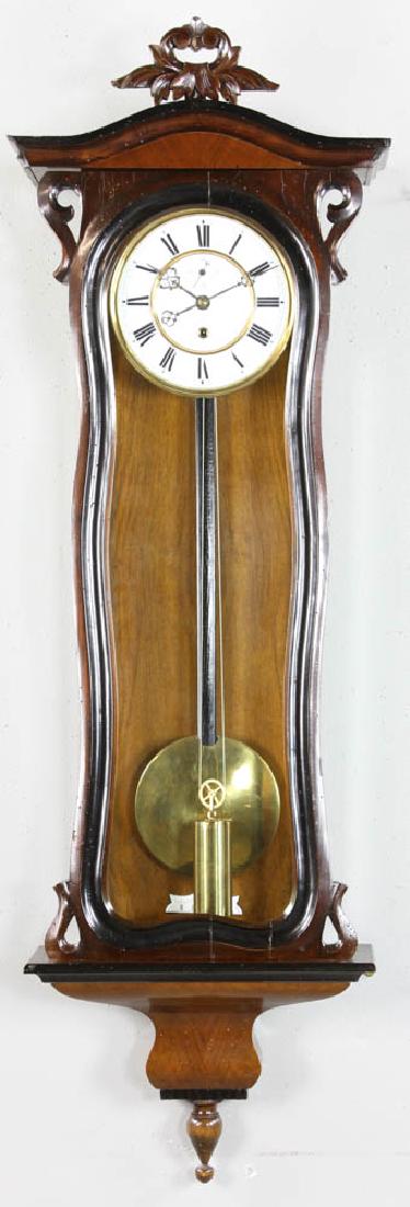 Vienna Regulator 8-Day Wall Clock: One-weight Vienna regulator clock, 8-day time only, porcelain face, 41" H x 14 1/2" W x 5 1/4" D. More extensive info available. Provenance: Beverly, Massachusetts estate.