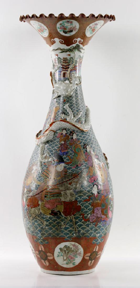 Meiji Period Satsuma Vase w/ Floral Petal Rim & Dragon: Meiji period Satsuma vase with floral petal rim on top, carved dragon on body, figures and sea motif, 36 1/2"H x 13 1/2" diameter top. Provenance: Massachusetts estate.
