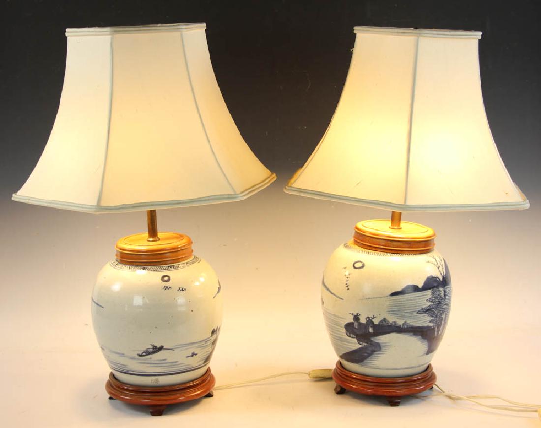 Pair of Chinese Blue and White Lamps: Pair of Chinese blue and white porcelain ginger jar lamps, silk shades, adjustable height, 8" H. Provenance: Estate of Joan Potter, Martha's Vineyard, Massachusetts.