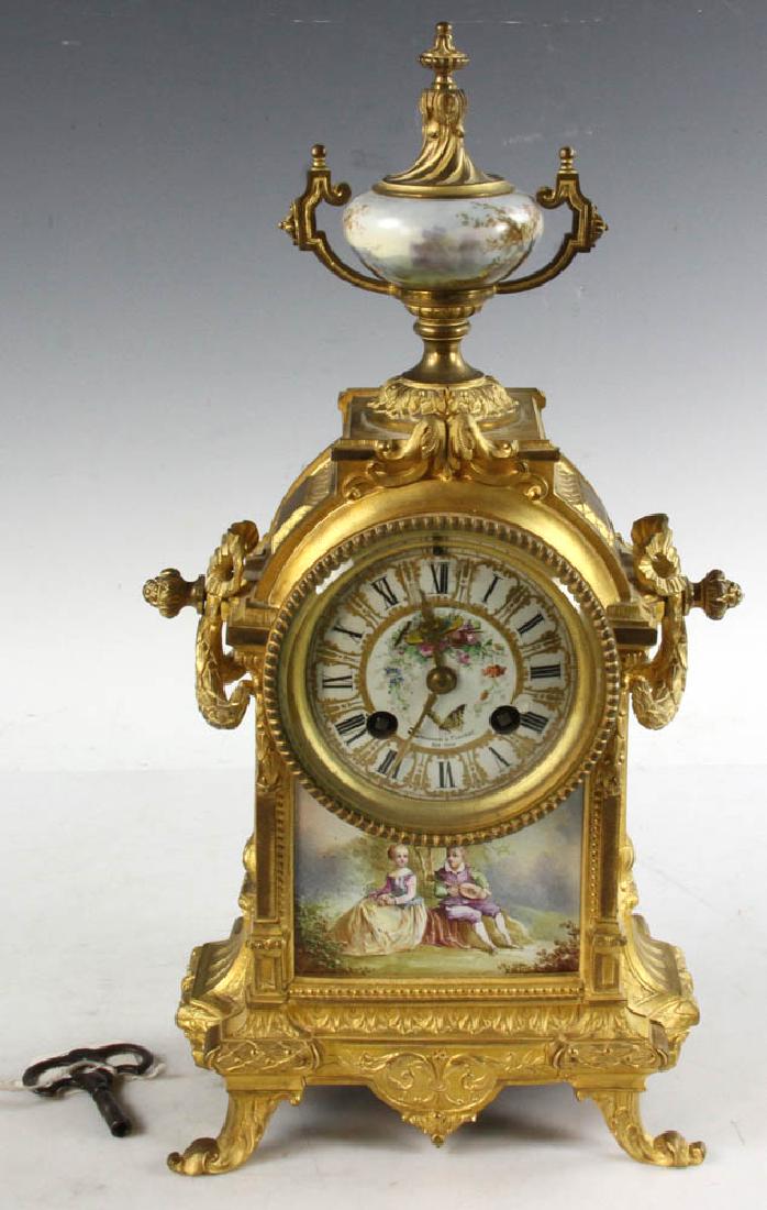 19th C French Gilt Bronze Mantle Clock: 19th century French gilt bronze mantle clock having hand-painted porcelain dial, 15" H x 7 1/2" x 4". Provenance: Beverly, Massachusetts estate.