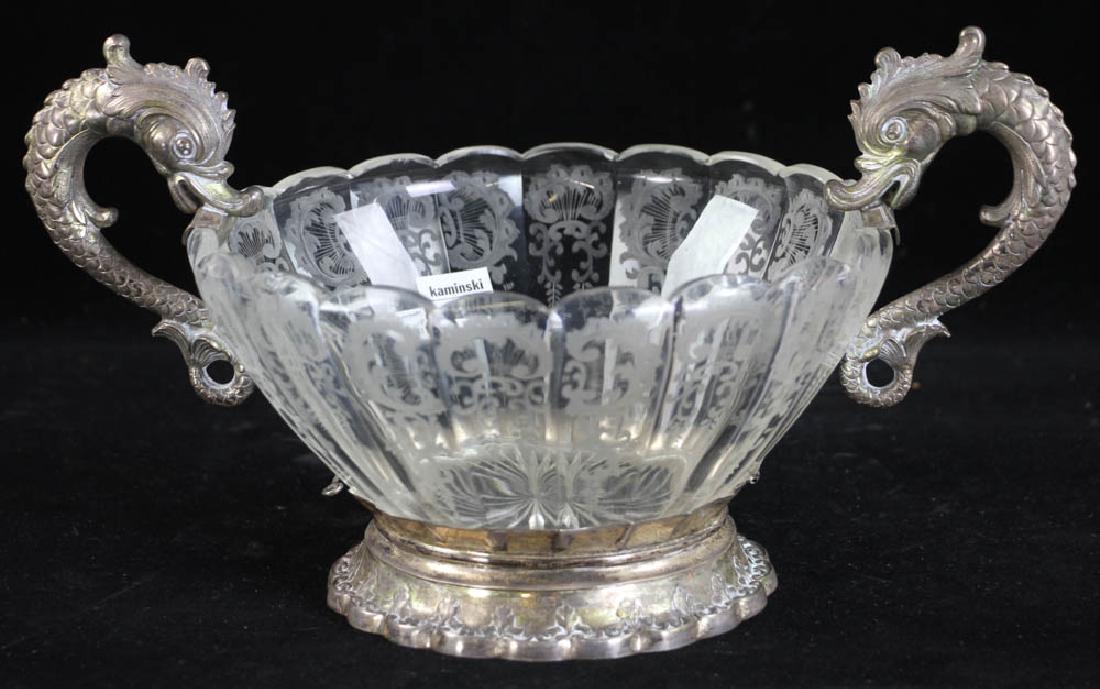 Etched Glass and Silver Bowl: Etched glass and .800 silver bowl with removable dolphin handles, 7" H (to handle) x 12 3/4" W (handle to handle), approximately 7.9 troy oz TW. Provenance: Malibu, California collection.
