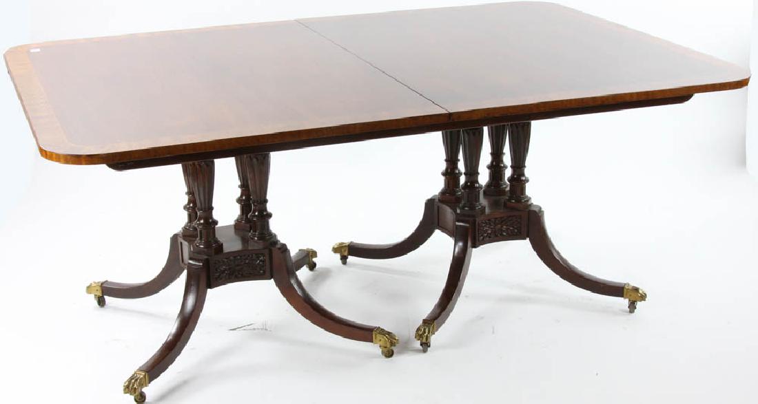 Regency Style Mahogany Dining Table: Regency-style mahogany and satinwood banded dining table with two leaves, 48" W x 70" L, with two 20" leaves.