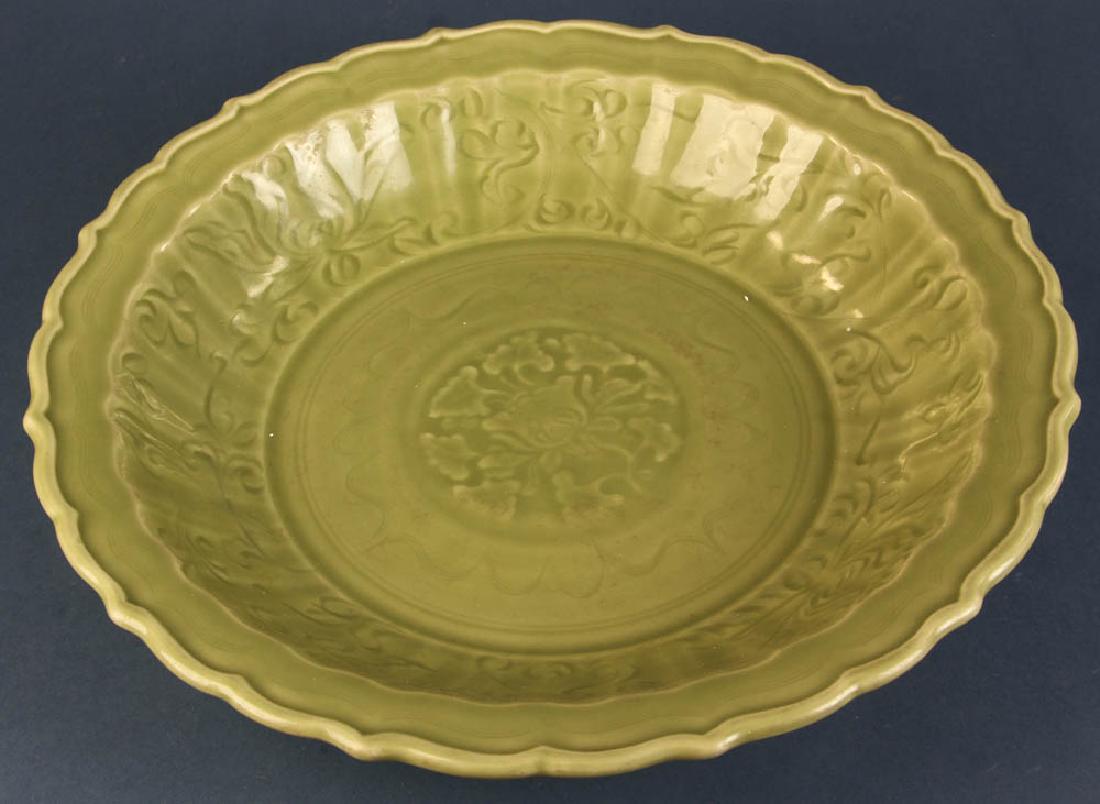 Chinese Large Longquan Celadon Charger: Large Chinese Longquan celadon glazed charger, carved flower design, later Ming dynasty, 15" diameter. Provenance: Newton, Massachusetts estate.