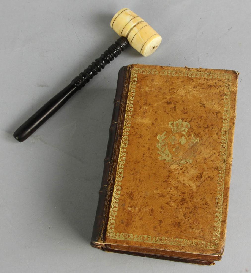 Antique Style Leather Book Safe: Antique-style leather book safe, designed as two volumes, 6 1/2" x 4 1/4", marked 'Made in France', together with antique ebony and bone gavel, 7 " x 2". Provenance: West Palm Beach, Florida collectio