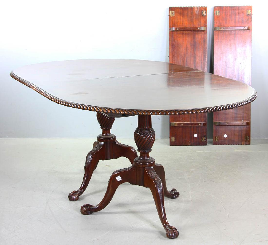 Mahogany Pedestal Dining Table: Mahogany pedestal dining table with rope edge, claw and ball feet, carved legs and column, 29 3/4" H x 71 1/2" W x 43 3/4" D, together with two (2) leaves 12" W. Provenance: Millis, Massachusetts coll