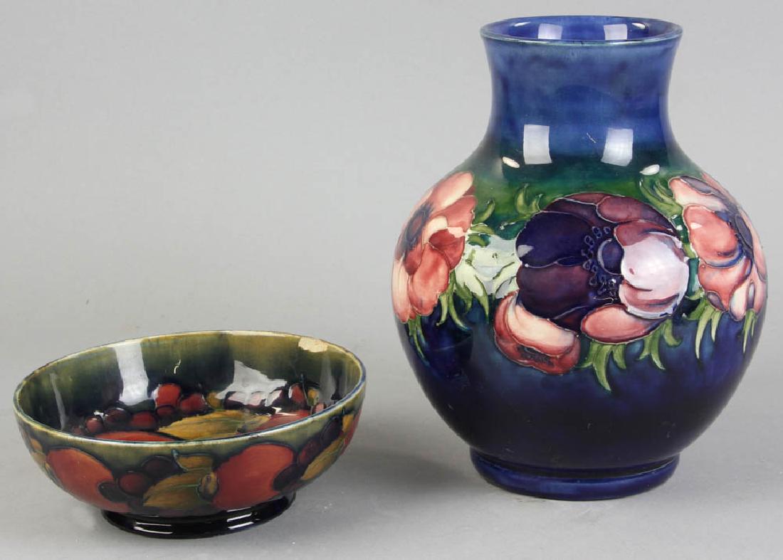 Moorcroft Anemone Vase, Pomegranate Bowl: Two pieces of Moorcroft art pottery, including: 'Anemone' vase, 8" x 6"; 'Pomegranate' bowl, 6". Artist signed. Bowl chipped. Provenance: Contents of a West Canton St, Boston estate.