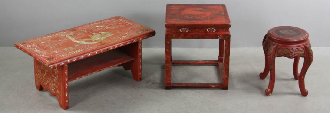 Chinese Red Lacquered Tables and Stool: Chinese red-lacquered low table with mother-of-pearl inlay, 13 1/2" H x 31 1/2" L x 17" together with a lacquered stool and side table. Provenance: Beverly, Massachusetts collection.