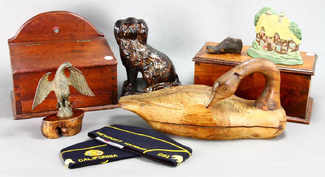Group of Early Decorative Pieces: Group of early pieces to include an old wooden goose, Rockingham-glazed spaniel, brass eagle, mustard-painted stool, cottage-form doorstop, salt box, etc. stool 13 14" H x 18 3/8", 9 3/4". Provenance: