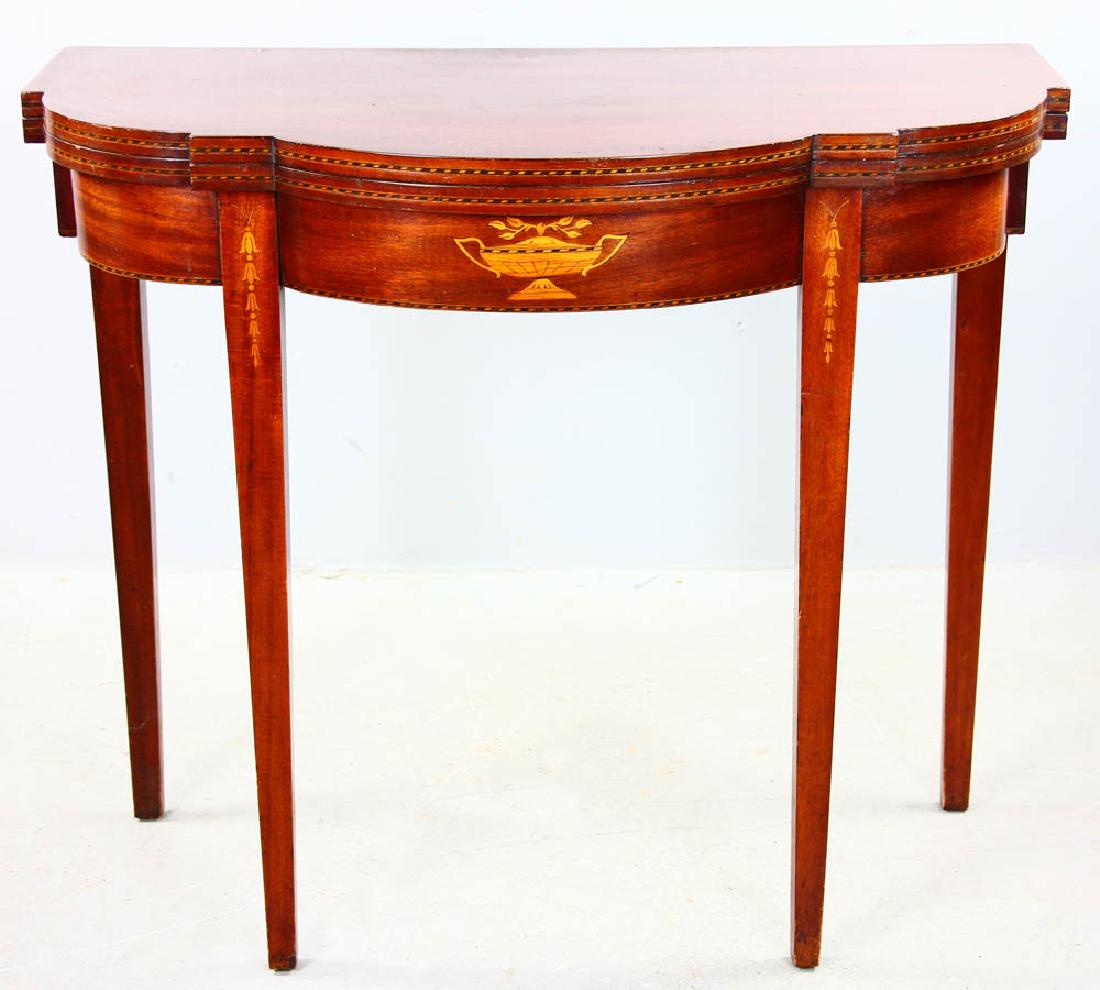 Late 19thC Hepplewhite Style Card Table: Late 19th century Hepplewhite-style mahogany card table having urn and bellflower inlay, 31 1/4" H x 36" W x 18" D. Provenance: Haverhill St., Reading, Massachusetts estate.