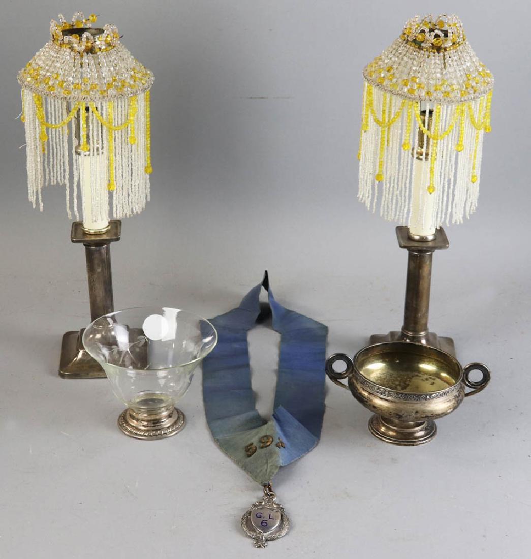 Silver and Silver plate Collection: Metal collection to include a pair of weighted sterling candlesticks, a sterling compote, a bowl with a sterling rim, and an English silver-plate medal with ribbon, tallest is 14" overall. Provenance: