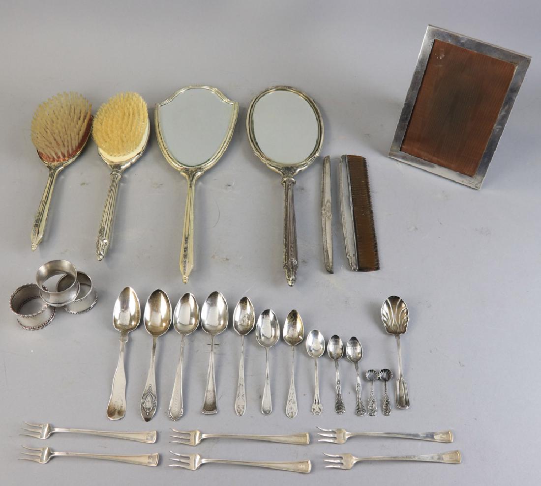 Collection of Sterling and Coin Silver Pieces: Collection of sterling and coin silver pieces, to include: three (3) napkin rings, six (6) cocktail forks, ten (10) spoons, three (3) coin silver spoons, two (2) three-piece dresser sets, and picture