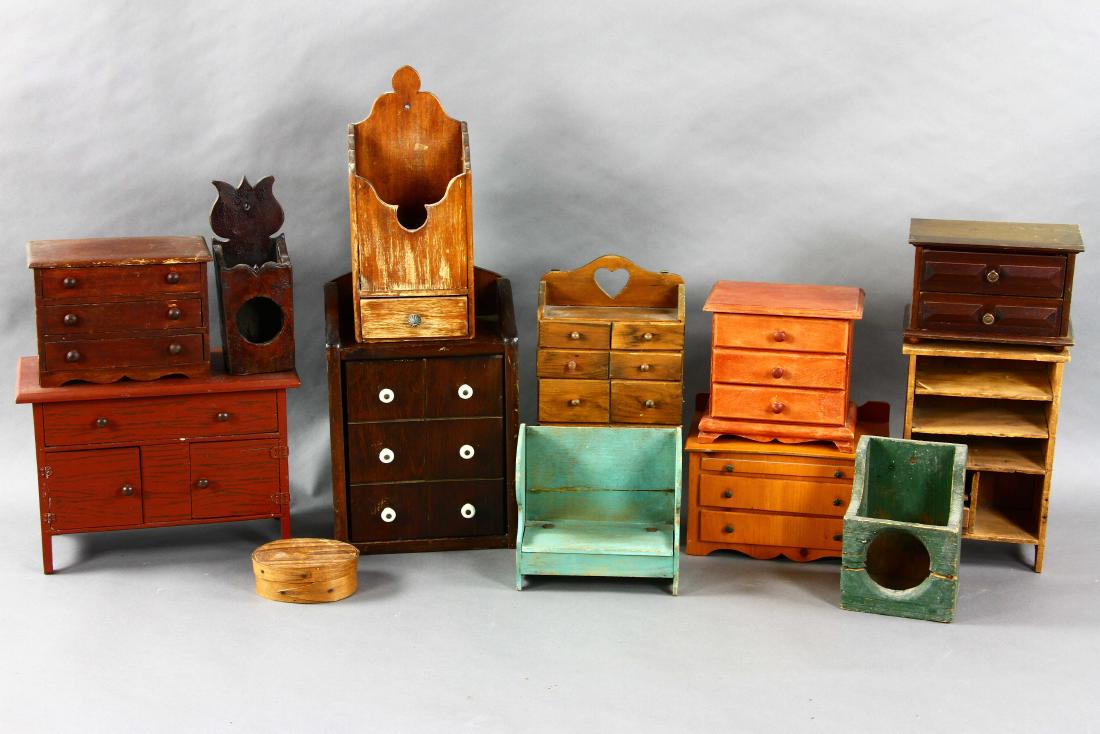 Group of Miniature Chests: Group of old miniature chests, candle boxes, small pantry box, etc., thirteen (13) pieces total, largest 10" H x 14" W x 6 1/2" D.