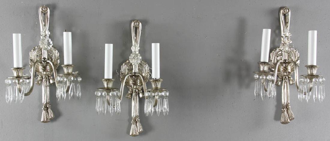 Three Two Branch Sconces with Glass Prisms: Three two-branch sconces with drapery design and glass prisms, 15" H x 9" W.