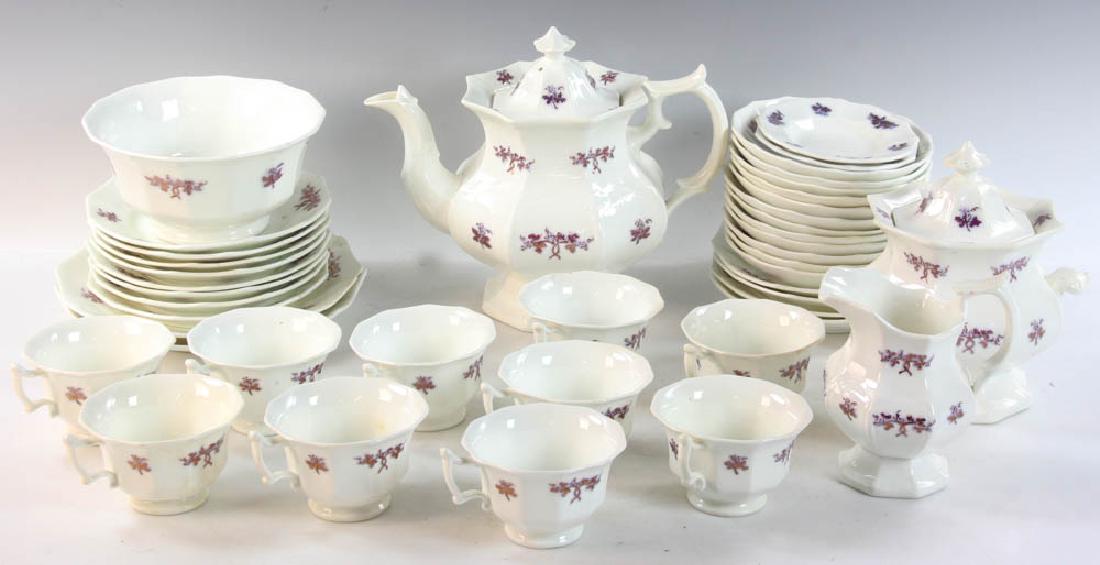 19thC English Chelsea Porcelain Tea Set: Mid-19th century English porcelain tea set, 'Chelsea' pattern with copper lustre, to include teapot, creamer, covered sugar, plates, bowl, cups, saucers.