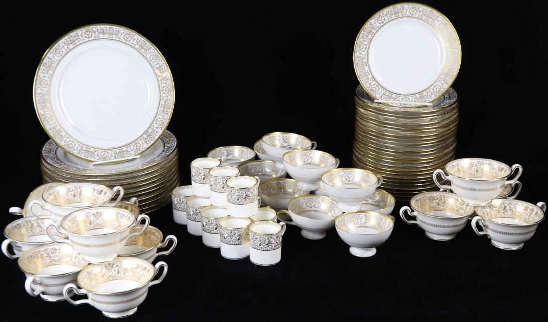 Bone China Tableware: Large group of bone china tableware, cream ground with gilt decoration, to include: twelve (12) Wedgwood Florentine pattern demitasse cups and ten (10) bouillon cups; forty-eight (48) pieces of Eschen