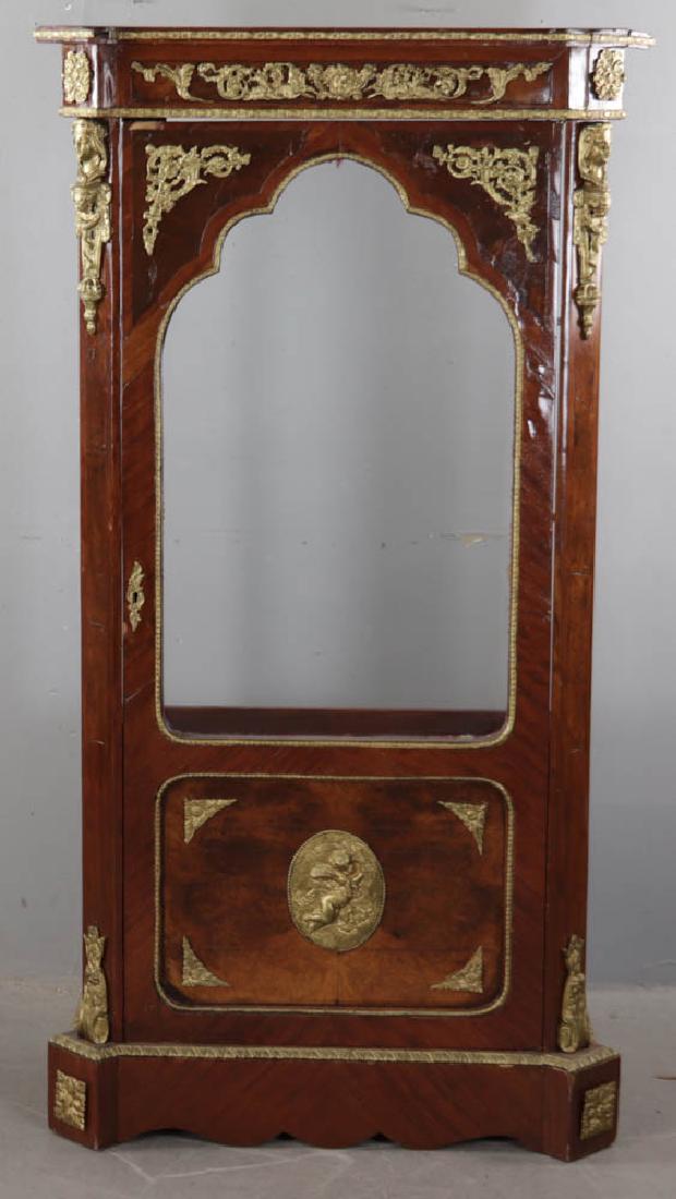Display Case with Ormolu Trim: Display case with ormolu trim, lacking back panel, 61" H x 33" W x 17" D.