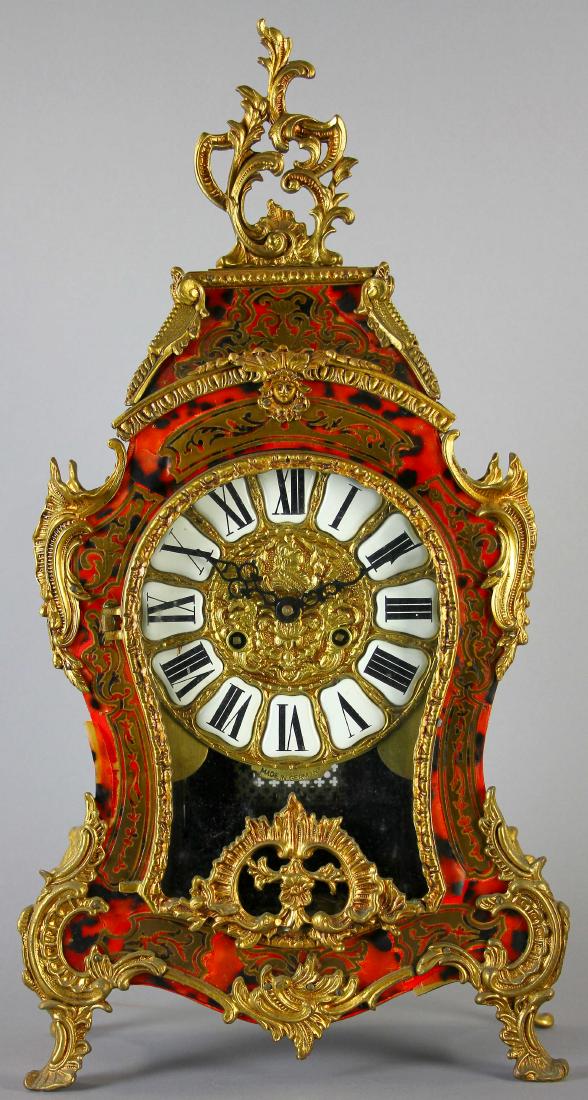 Boulle Style Clock with Bronze Ormolu: Boulle-style clock with bronze ormolu, marked 'Made in Italy', 23" H x 11 1/2" W x 5" D, finish damage.