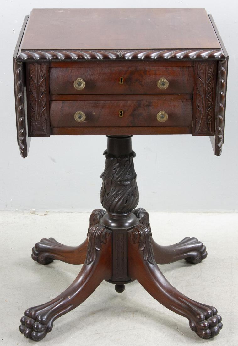 American Empire Style Drop Leaf Table: American Empire-style mahogany drop-leaf table with claw feet, rope turned edge, 28" H x 18" W x 17" D.