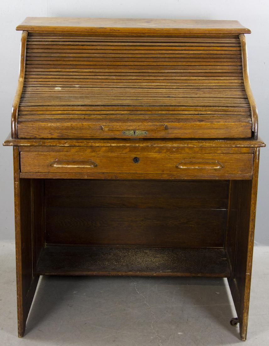Antique Oak Roll Top Desk: Antique oak roll-top desk, 44" H x 36" W x 29" D.