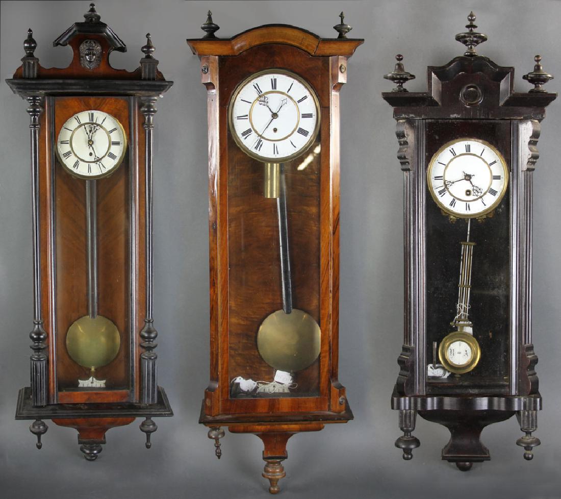 Group of Three Wall Clocks: Group of three wall clocks, tallest 31" H. Provenance: Hampton, New Hampshire estate.