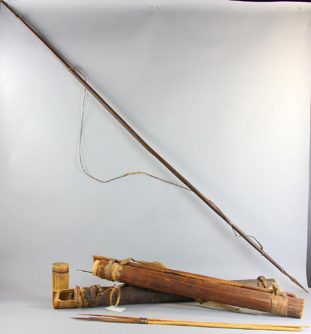 19th/20thC Asmat Tribe Bow, Quivers, Arrows: Late 19th/early 20th century Asmat tribe (Papua, New Guinea) bow, 70" long, and two quivers, one with nine arrows (including spear), the other with fourteen arrows. Provenance: Marblehead, Massachuset