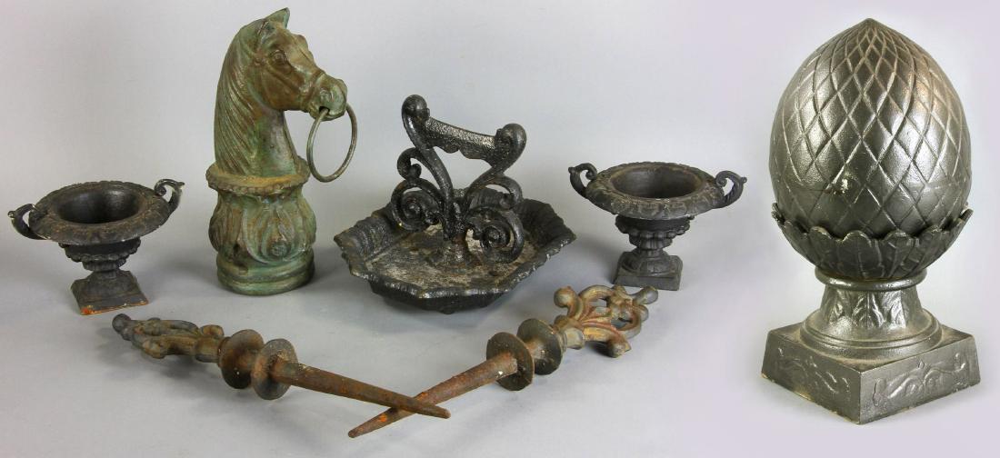 Group of Old Iron Items, Boot Scrape, Urns, Etc: Group of old iron items to include boot scrape, two small urns, horse head-form hitching post top, etc., seven (7) pieces total, tallest 15 1/4"