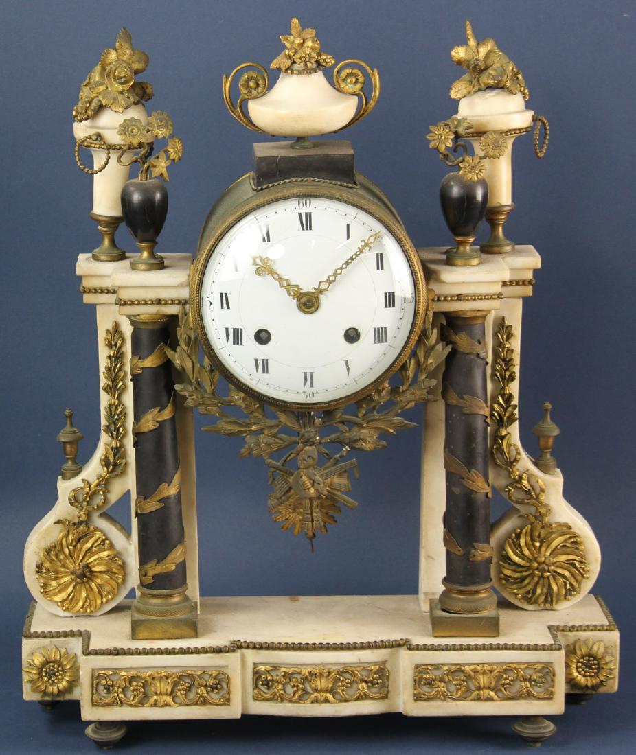 19thC French Pillar Clock with Marble and Ormolu: 19th century French pillar clock with white marble and ormolu mounts, having pendulum, 18" H x 15" W x 4.25" D.