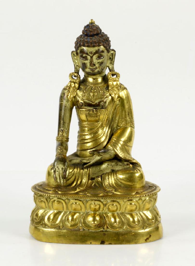 18thC Mongolian Gilt Bronze Buddha Figure: 18th century Mongolian gilt bronze Buddha figure, sitting with legs crossed on lotus stand, 7 1/2" H. Missing the medicine bowl in hand. Provenance: From a New York private collection.