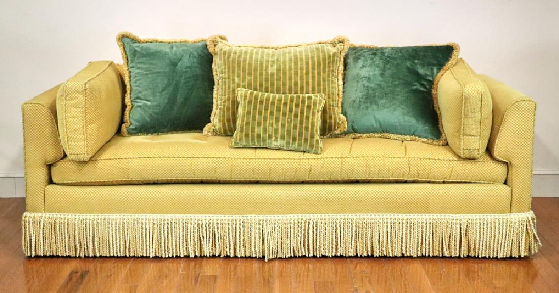 Gold Upholstered Sofa: Gold upholstered sofa with fringe, 29" H x 91" L x 35" D. Includes throw pillows. Owner paid $6000.