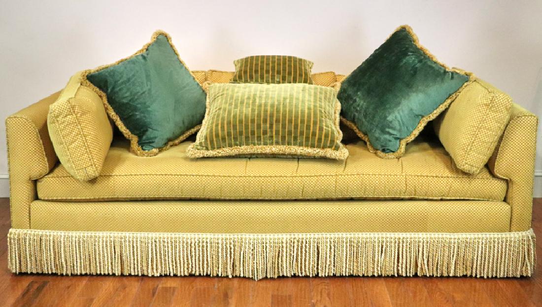 Gold Upholstered Sofa: Gold upholstered sofa with fringe, 29" H x 91" L x 35" D. Includes throw pillows. Owner paid $6000.