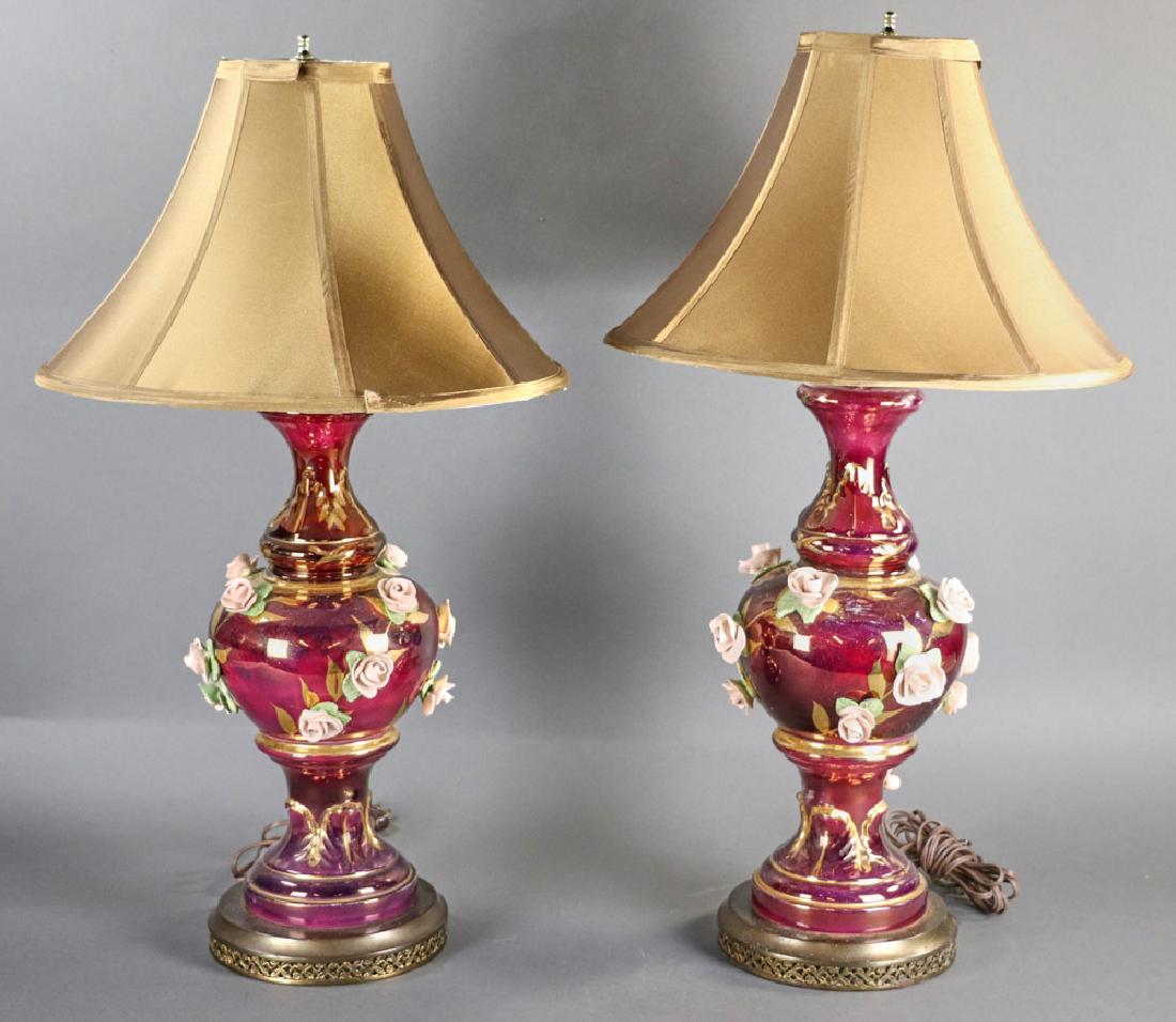 Pair of French Style Porcelain Table Lamps: Pair of French-style porcelain lamps with applied rosettes and silk shades, 28" H x 16" diameter - shade. Provenance: Boston, Massachusetts estate.