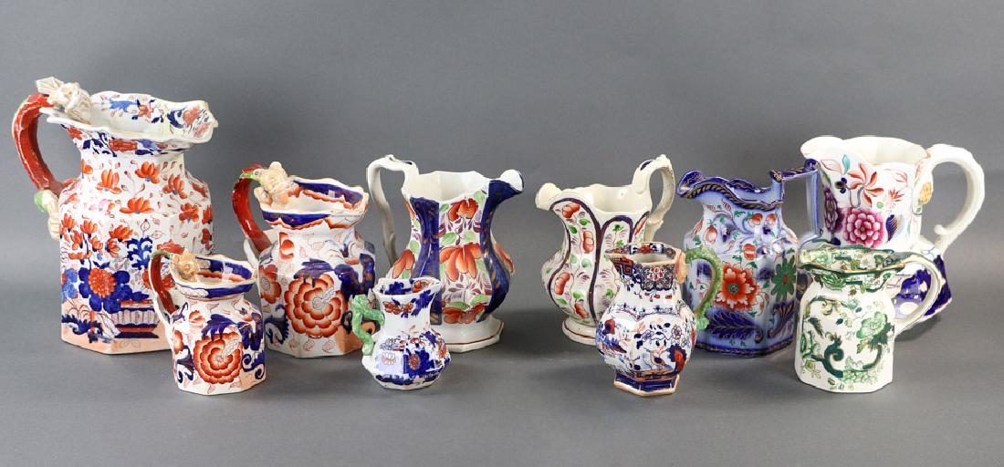 Late 19thC English Mason's Ironstone Pitchers: Collection of 19th century English polychrome ironstone pitchers, various patterns, two (2) marked 'Mason's Ironstone China', three (3) with figural dragon handles, ten (10) total, tallest piece 9 1/2