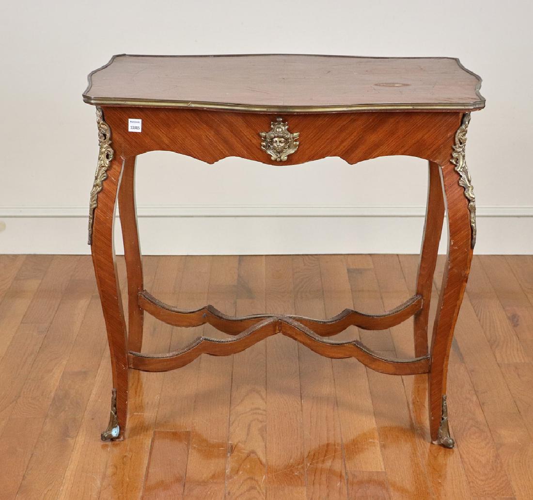 French Parlor Table with Ormolu Mounts: French parlor table having ormolu mounts, 30" H x 33" W x 23" D. Provenance: Florida estate.