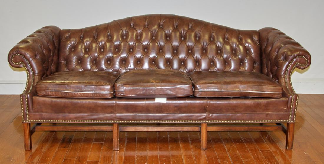 Leather Chesterfield Sofa with Brass Tack Trim: Tufted leather Chesterfield sofa with brass tack trim by Leathercraft Inc., Hickory, North Carolina, 36" H x 88" W x approximately 34" D. Provenance: from a Swampscott, Massachusetts collection.