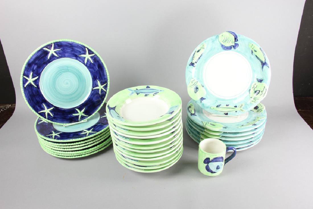 Italian Vietri Dinnerware: Italian 'Vietri' dinnerware, to include: (7) 12 3/4" plates with fish; (12) 9 1/2" bowls with fish; (8) 12 5/8" plates with starfish; (1) 8" H pitcher with starfish.