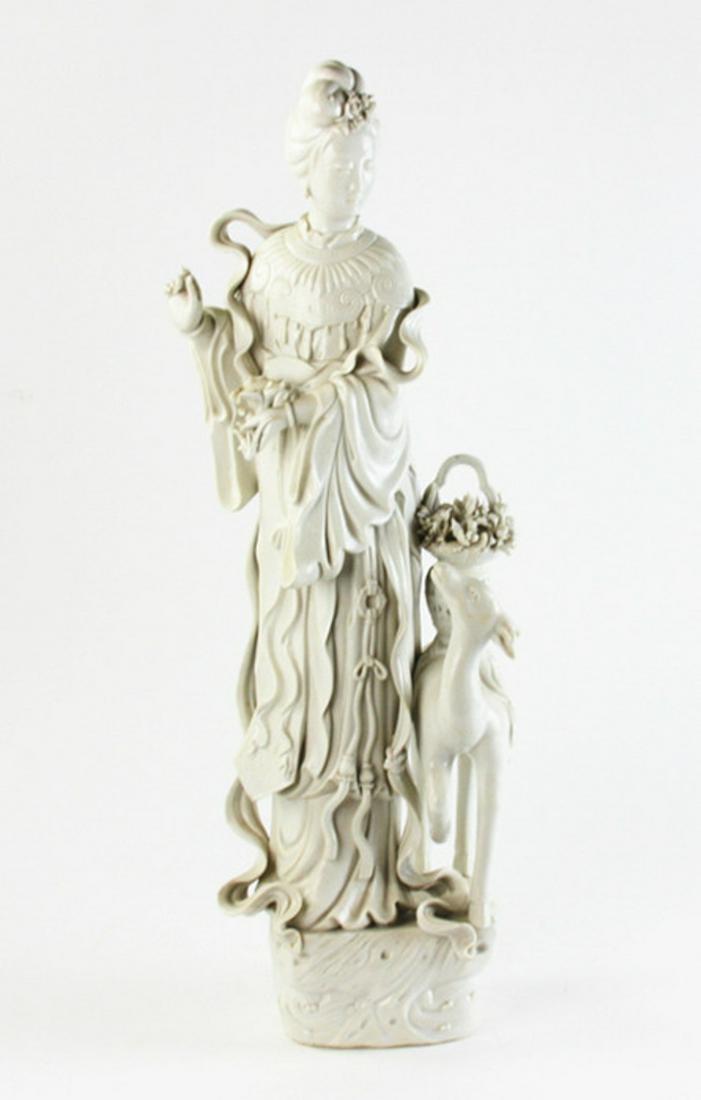 Chinese Blanc-de-Chine Standing FIgure: Chinese blanc-de-Chine standing figure with deer and basket of flowers, 25" H x 9". Missing antlers. Provenance: Marietta, Georgia collection.
