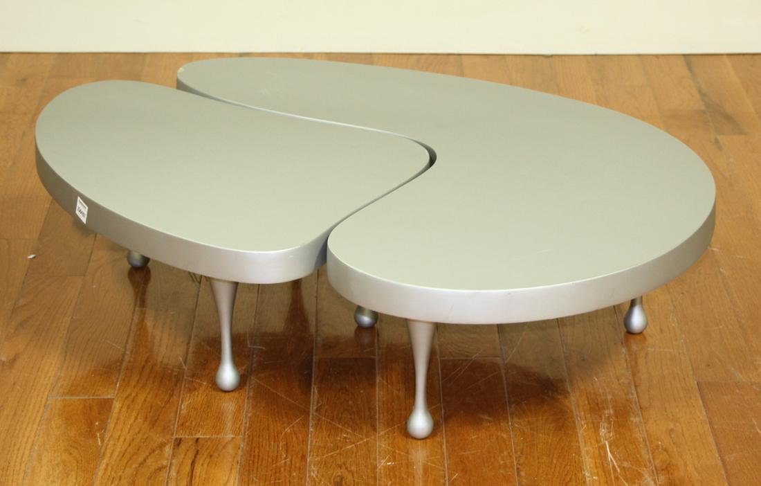 Frederick John Kiesler Style Coffee Tables: Frederick John Kiesler-style aluminum nesting coffee tables, unmarked, 25" x 16" and 35" x 25", chip on top corner of larger table. Provenance: Cambridge, Massachusetts collection.
