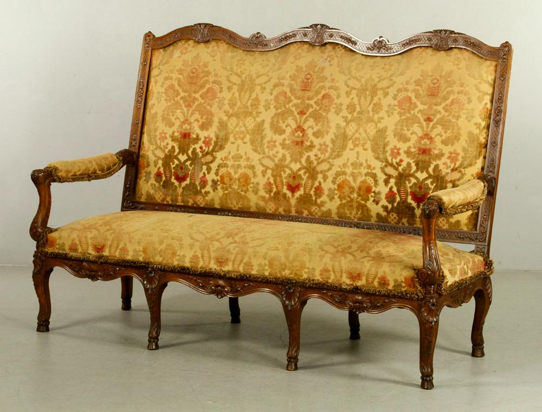 19thC Italian Carved Sofa: 19th century Italian sofa with carved legs and upholstered seat, 48" h x 64" w x 33" d. Provenance: From a California estate.