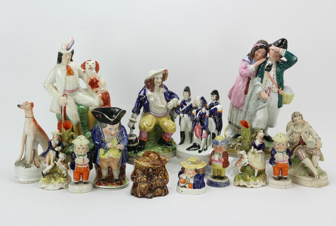 Large Group of Staffordshire China: Large group of Staffordshire china, to include: Tobies, pepperettes, spill vases, etc., fourteen (14) pieces total, tallest 13 1/2". Provenance: Daniels House Salem, Massachusetts.