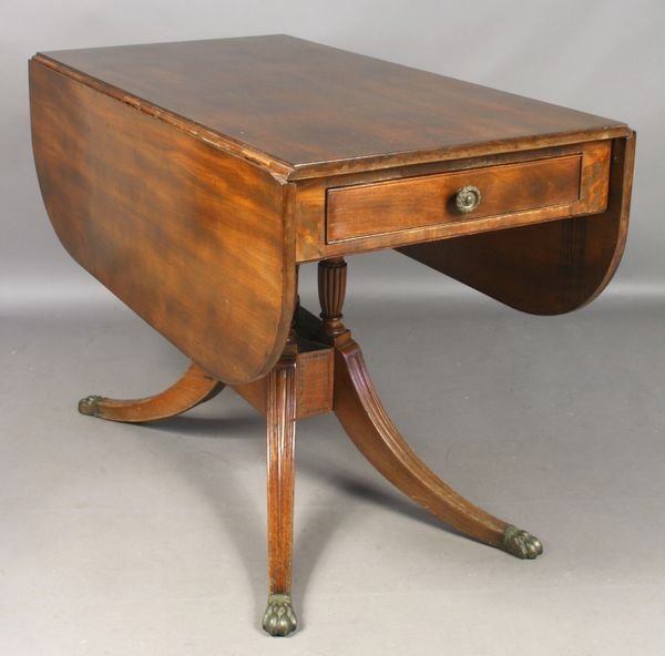 19th C. New York Duncan Phyfe Sofa Table: Early 19th Century New York Duncan Phyfe mahogany sofa table with fine reeded columns, brass claw feet and inlay around the base, 27"h. x 46"l. x 40"w. Newer finish.