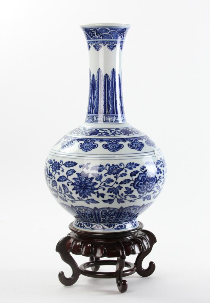 Chinese Blue and White Bottle Vase: Chinese blue and white porcelain bottle vase with Qianlong mark on base, 15" H. Provenance: Boston prominent private collectors, acquired form the Carlton, 78 Hatfield rd. Ipswich, UK by old museum au