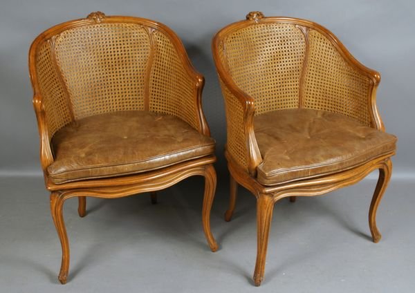 Pair of Louis XV Carved Fruitwood Arm Chairs.