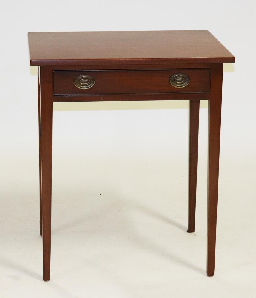 Kittinger Hepplewhite Style Mahogany Lamp Table: Kittinger Hepplewhite-style mahogany lamp table with drawer, branded Colonial Williamsburg label, 30" H x 25 1/4" W x 18 3/4" D. Provenance: From a Woburn, Massachusetts estate.