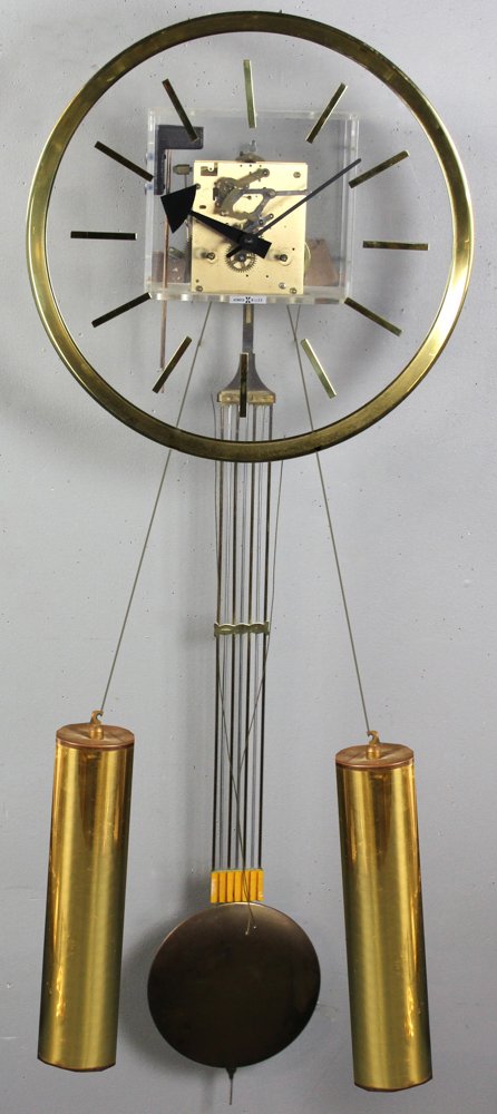 Howard Miller Lucite Wall Clock by George Nelson: Howard Miller lucite wall clock designed by George Nelson, with key, 44" H x 15" diameter. Provenance: Jupiter, Florida collection.