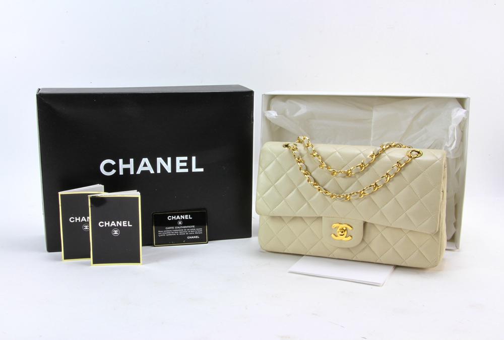 Chanel Quilted Caviar Classic Flap Shoulder Bag: Chanel Quilted Caviar Classic Flap 223000 shoulder bag, slightly used, overall very good condition, having book and box. Provenance: From a California collector.
