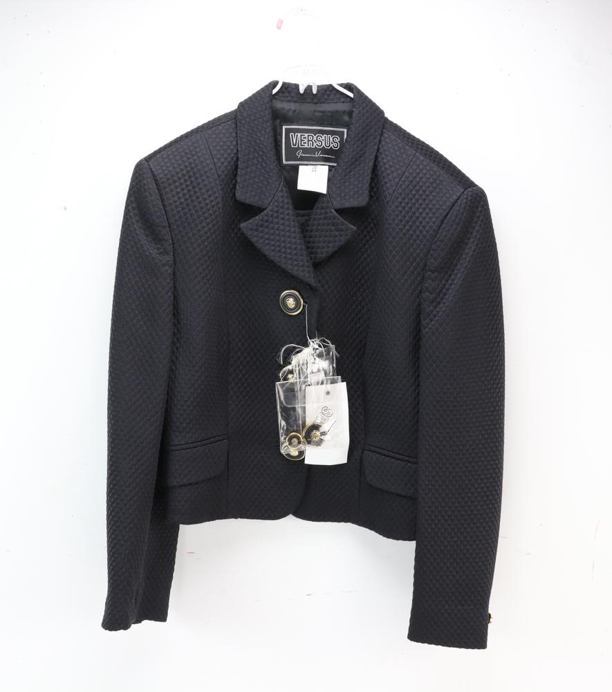 Versus by Versace Jacket and Mini Skirt: Versus by Versace black pique jacket and mini skirt with rhinestone detail, NWT. Provenance: From a Hamilton, Massachusetts estate.